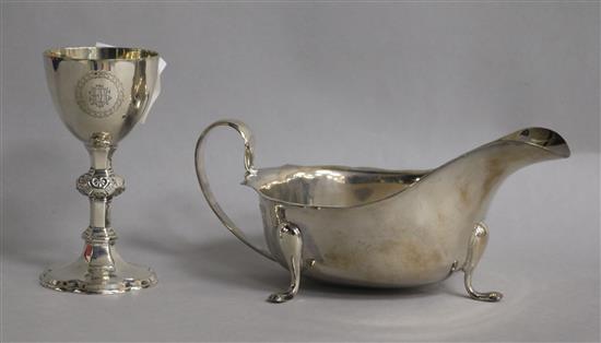 A late Victorian silver communion chalice and a later silver sauceboat, 7 0z.